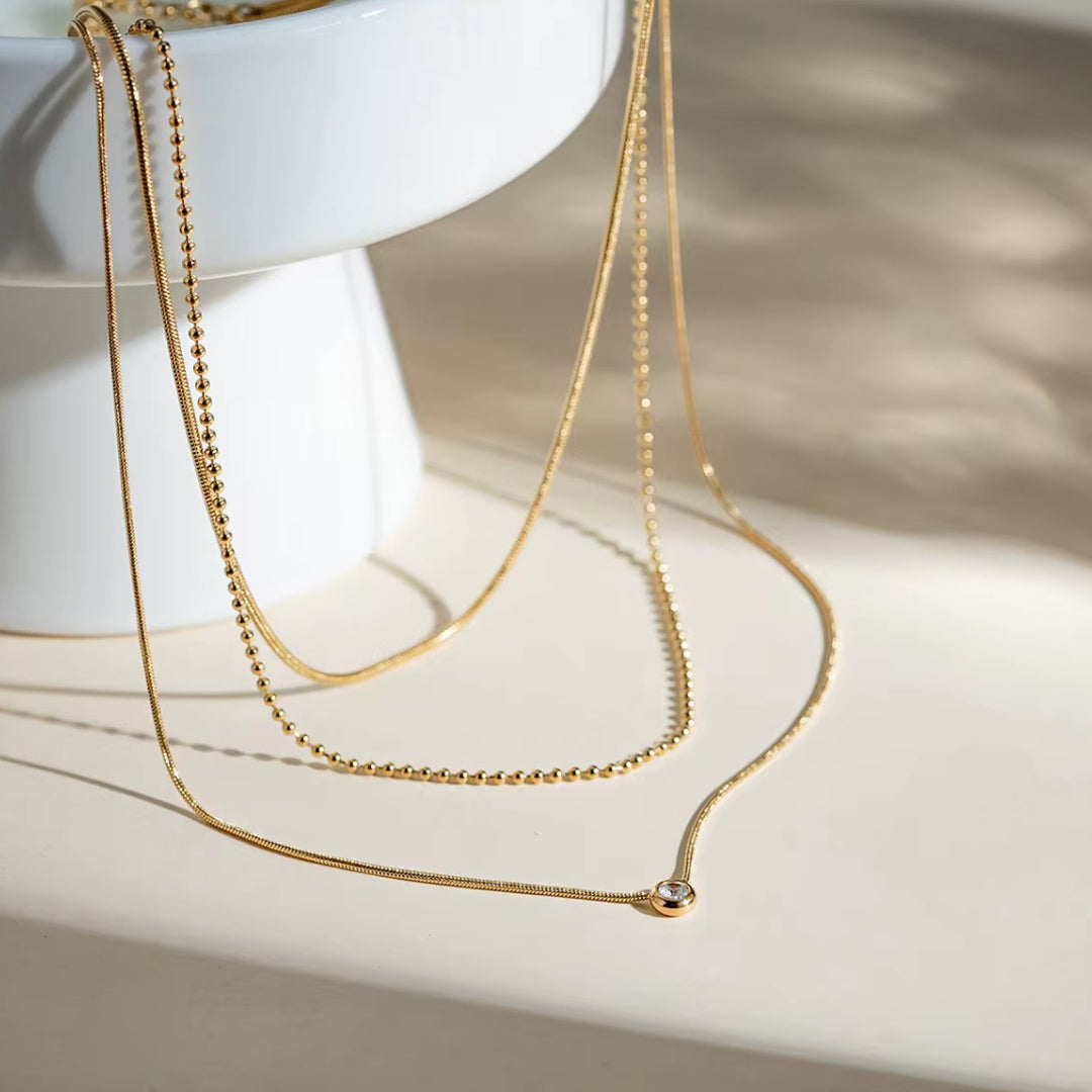 Collar triple caída